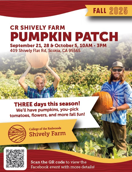 two farmers holding pumpkins